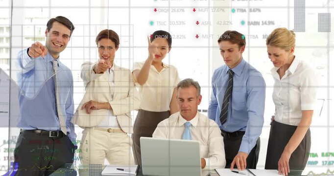 Seated exec using laptop sparking finance charts, team shifting to pointing at camera for clients