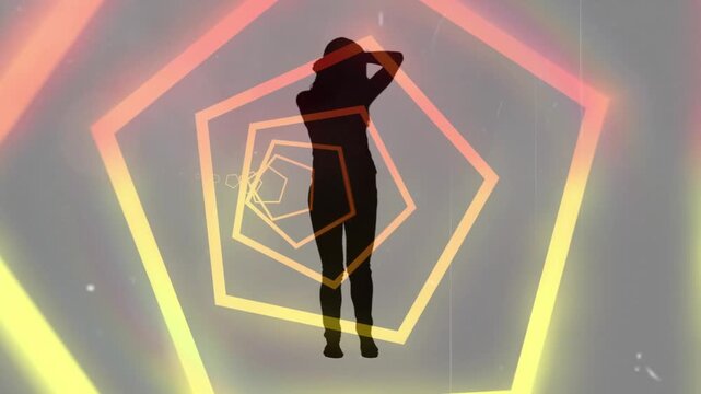 Performer responding to cycling pentagon lights, moving through pose sequence for art installation