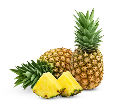 Ripe fresh pineapples and pineapple slices isolated on white background. Juicy pineapple and slice of pineapple with clipping path.