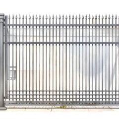 A metal gate with pointed tips and vertical bars on a concrete base