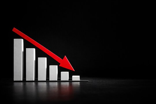 Declining bar chart with red downward arrow representing financial loss, recession, and economic downturn