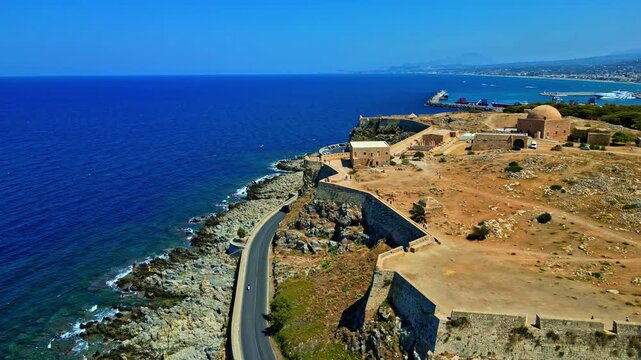 Drone flight over the Venetian Fortezza Castle at the shores of the mediterranean sea in Greece.