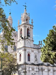 Ornate White Baroque Church Architecture with Bell Towers and Domes under Blue Sky
