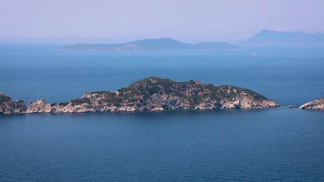Gravia islet seen from Afionas village on the Greek island of Corfu, Mathraki Island on background, 4k video