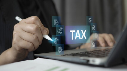 Naklejka premium Business professional using digital pen analyzing tax management and financial accounting on laptop with virtual tax icons. Concept of taxation planning, accounting, financial compliance a