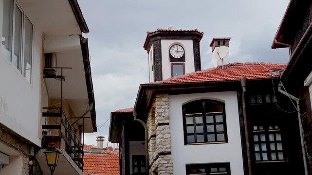 Tower with clock on old part of Nesebar historic city on Black Sea shore in Bulgaria, 4k