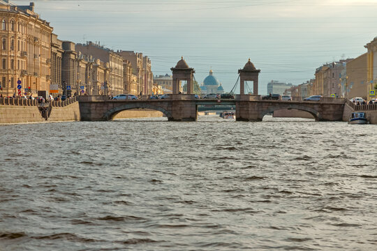 View of the Lomonosov Bridge on the Fontaka River and dome of the Izmailovsky Cathedral in St. Petersburg in day, Russia