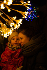 Obraz premium Mother Showing Affection to Child in Holiday Setting