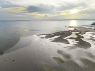 The calm atmosphere of the morning as the sun begins to appear on the eastern horizon of Sumba, near the mouth of the Payeti River, directly facing the Waingapu sea © HeinrichDengi