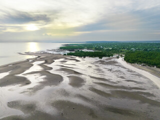 The calm atmosphere of the morning as the sun begins to appear on the eastern horizon of Sumba, near the mouth of the Payeti River, directly facing the Waingapu sea © HeinrichDengi