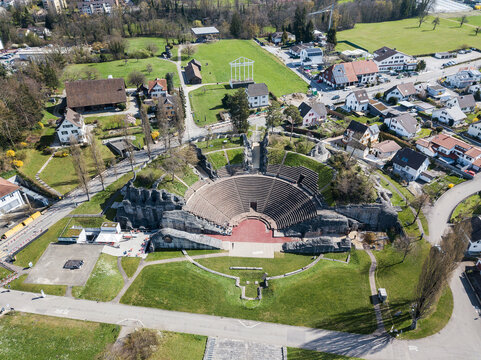 Kaiseraugst, Switzerland - March 28. 2023: Aerial drone view over the ancient Roman amphitheater at Augusta Raurica in Kaiseraugst. It was founded by Lucius Munatius Plancus around 44 BC