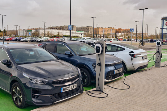 Electric Vehicle Charging Infrastructure Several Electric Cars Charging At Charging Stations In A Parking Lot In Getafe Madrid Spain Promoting Green Transportation