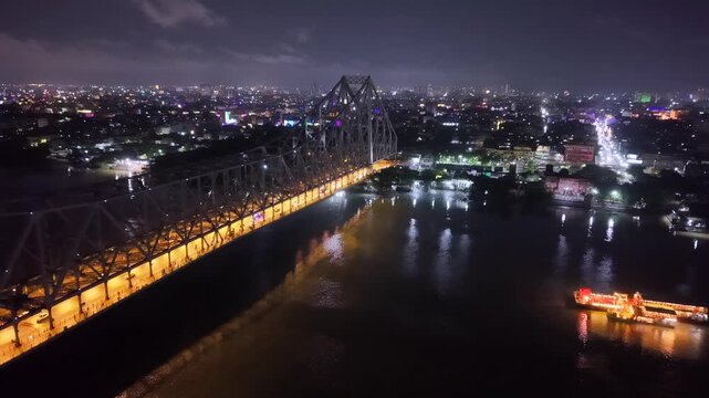 Aerial Night View of Howrah Bridge and Ferry River Kolkata, India