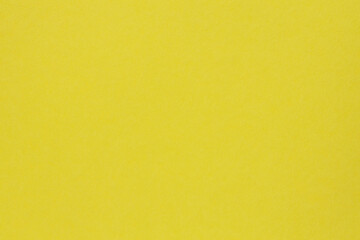 Fototapeta premium Vibrant yellow paper background with smooth color transition for modern design