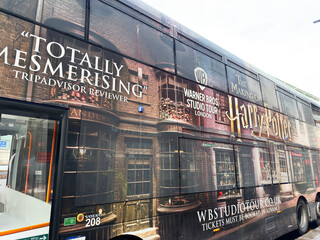 Naklejka premium Bus wrap advertising for Warner Bros Studio Tour London Harry Potter experience in London UK