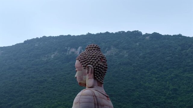 Aerial View of Giant Buddha Statue in Lake Surrounded by Hills Rajgir Bihar India