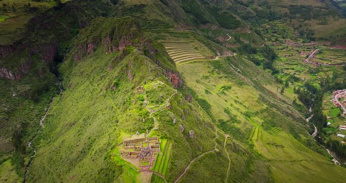 Incredible Pisac Inca ruins on lush mountain slope of Sacred Valley, Peru. Drone