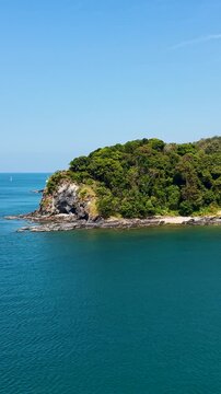 Breathtaking video capturing the serene beauty of Khlong Chak Beach on Ko Lanta Island, Thailand. Aerial footage showcases lush green landscapes and pristine waters.