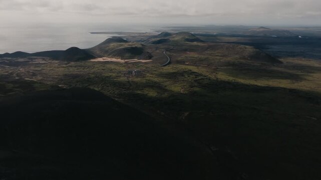 Aerial drone view of the Geldingadalir volcanic area in Iceland, featuring rugged terrain, cooled lava fields and dramatic Nordic landscape. Remote natural environment and geology concept.