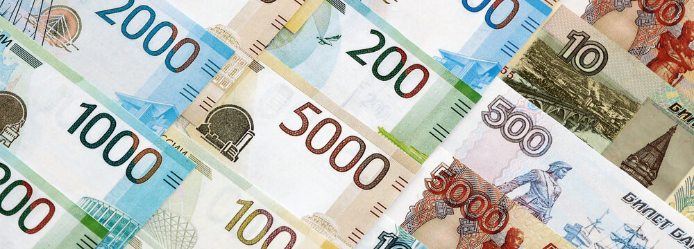 Russian ruble paper banknotes pile on table. Russia RUB currency money bills in big amount. Concept of economics, taxation and banking in Russia
