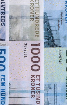 Danish krone paper banknotes pile on table. Denmark DKK currency money bills in big amount. Concept of economics, taxation and banking in Denmark