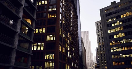 Obraz premium dusk urban canyon with lit windows and glass facades, golden office lights reflecting on narrow street, historic brownstone beside modern tower, moody twilight