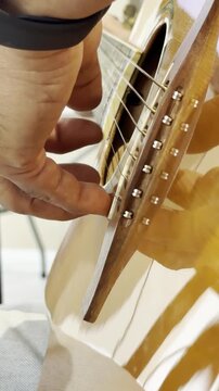 Close to Human Left handed fingerpicking guitar player.