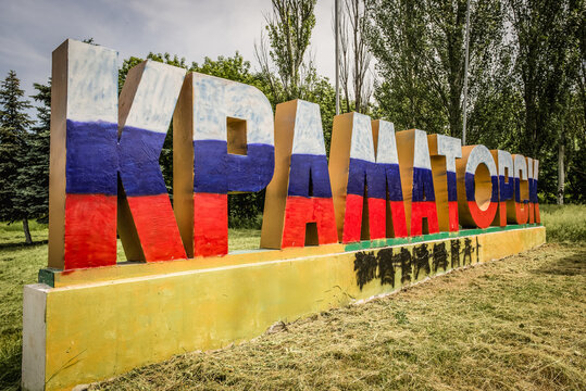Kramatorsk town sign painted in russian flag during Russo-Ukrainian War in Donbas region, Ukraine