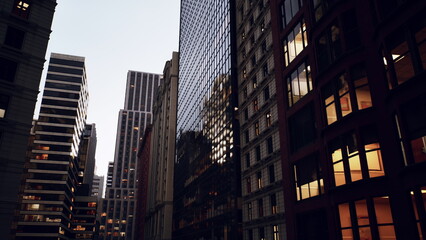 Naklejka premium moody urban canyon at dusk showcasing glass facades, lit office windows, narrow street framed by towering highrises, warm interior glows against cool sky,