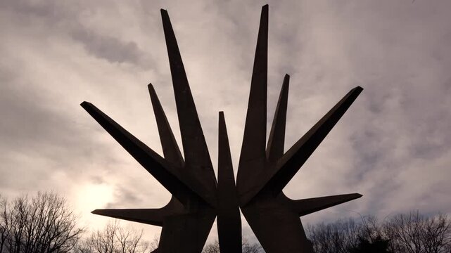 Timelapse video of the Kosmaj Monument in Serbia, with dramatic clouds moving past the brutalist concrete structure. Atmospheric memorial footage. Kosmaj, Serbia 25.02.2026

