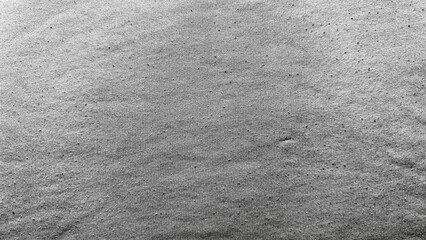 speckled gray abstract texture reveals fine grain scattered dots gentle undulation monochrome macro...