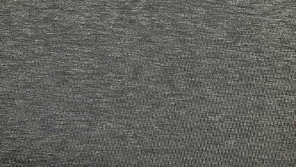 heathered gray cotton jersey knit fabric macro texture with subtle mottled flecks and soft neutral tones filling frame