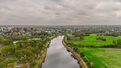 Obraz premium Panoramic Aerial Drone view of Inner Suburbs of Melbourne housing, roof tops, the streets and the parks, the roads and trees of Ascot Vale Moonee Ponds Brunswick Essendon and Maribyrnong in VIC Victor