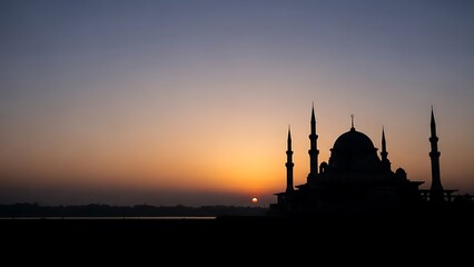 Naklejka premium Silhouette of a Mosque at Sunset.