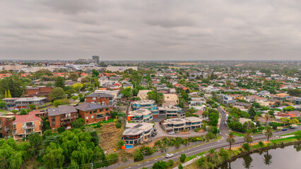 Obraz premium Panoramic Aerial Drone view of Inner Suburbs of Melbourne housing, roof tops, the streets and the parks, the roads and trees of Ascot Vale Moonee Ponds Brunswick Essendon and Maribyrnong in VIC Victor