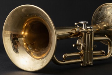 Naklejka premium Close-up of a Brass Trumpet on Black Background