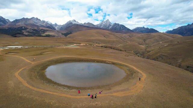 Alpine Lake in Sichuan Tibetan Plateau with Snow-Capped Mountains