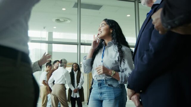 Woman talking with colleagues at conference