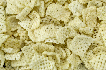 The texture of the crispy snack chips is square in shape with seaweed seasoning. © Hendri