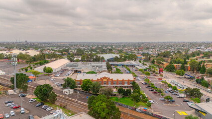 Obraz premium Panoramic Aerial Drone view of Inner Suburbs of Melbourne housing, roof tops, the streets and the parks, the roads and trees of Ascot Vale Moonee Ponds Brunswick Essendon and Maribyrnong in VIC Victor