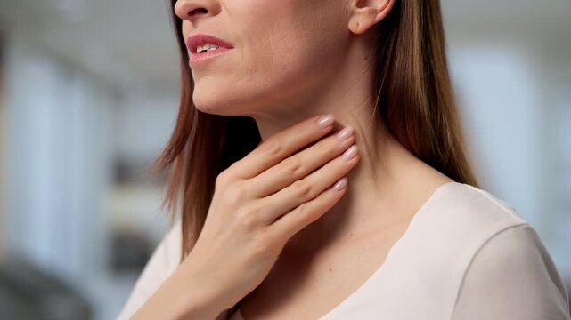 Throat And Salivary Gland Disorders. Woman Experiencing Neck Pain
