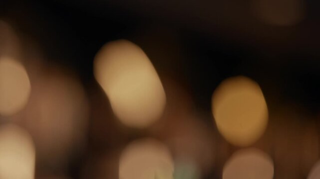 Cocktail glass with green garnish, soft bokeh lights behind. Elegant drink scene, warm ambiance, perfect for nightlife or luxury events. Ideal for bars, restaurants