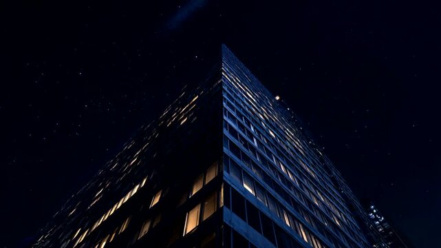 Night view of a modern building under starry sky