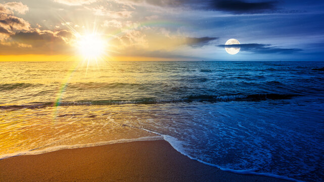 sandy sea beach background on autumn equinox. day meet night. sun and moon over empty seascape scenery with calm waves. beauty seashore wallpaper for astrology. bay photo for advertising