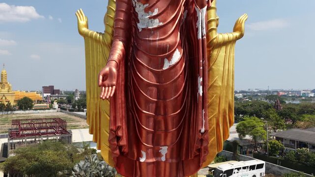 Giant standing buddha statue at wat sam phran temple