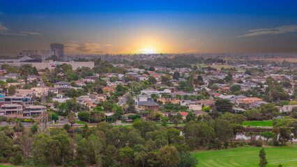 Naklejka premium Panoramic Aerial Drone view of Inner Suburbs of Melbourne housing, roof tops, the streets and the parks, the roads and trees of Ascot Vale Moonee Ponds Brunswick Essendon and Maribyrnong in VIC Victor