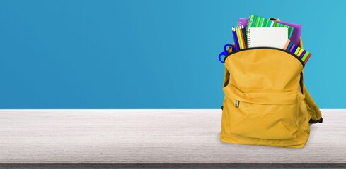 Modern schoolbag with various supplies for education © BillionPhotos.com