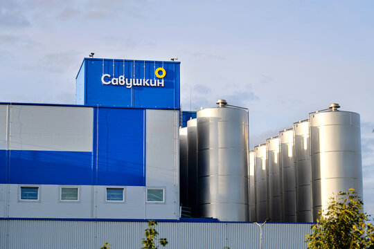 Bereza, Belarus. Sep 23, 2025. JSC Savushkin Product - modern dairy processing factory with large stainless steel storage tanks and blue industrial building exterior under clear daylight sky