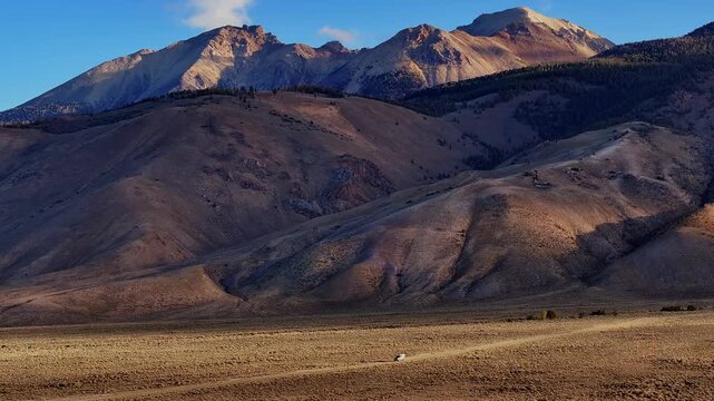Golden light on Borah Peak above open Idaho basin near Highway 93