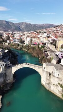 Drone aerial view of Stari Most (Old Bridge) and Koski Mehmed Pasha Mosque in Mostar, Bosnia and Herzegovina
